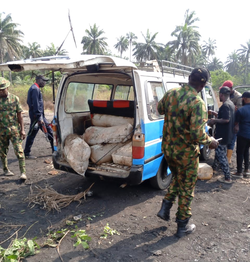Nigerian Army 6 Division troops intercept a commercial bus on Monday on the Oguta Omoku Road in Rivers transporting over 1500 litres of stolen crude oil hidden in sack bags