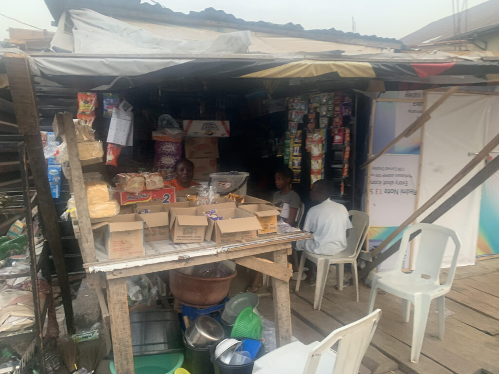 “Who will lend us money now?” How domestic violence robbed Kokumo street 4 A photo of Mama Aisha at her provision store