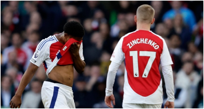 Arsenal’s English midfielder #49 Myles Lewis-Skelly (L) reacts after having been shown a red card during the English Premier League football match between Arsenal and West Ham United at the Emirates Stadium in London on February 22, 2025. (Photo by Ian Kington / IKIMAGES / AFP)