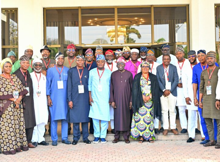 President Bola Ahmed Tinubu (middle), in a group photograph with Members of Lagos State House of Assembly, after a meeting at Presidential Villa Abuja on Wednesday