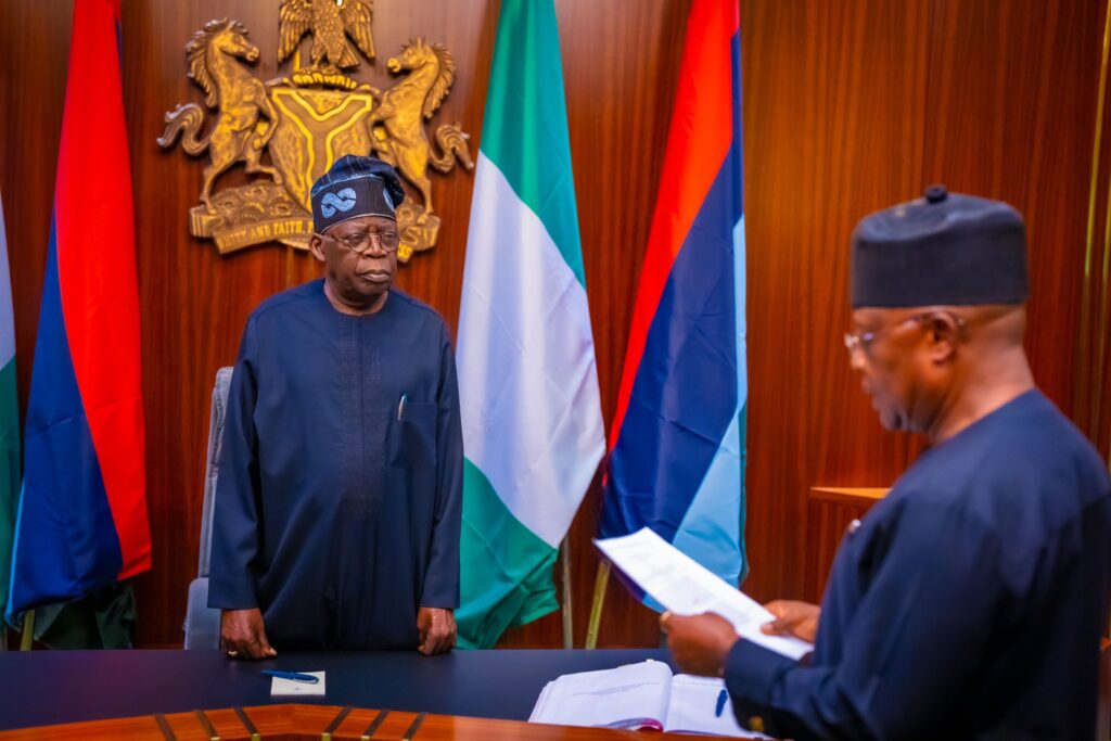 President Bola Tinubu and Vice Admiral Ibok-Ete Ekwe Ibas (rtd), the sole administrator of Rivers State, during a short swearing ceremony at State House, Abuja