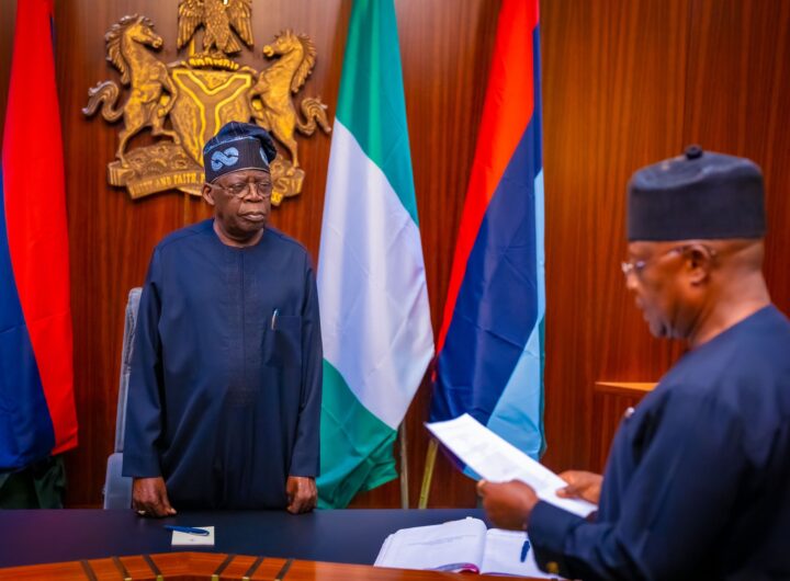 President Bola Tinubu and Vice Admiral Ibok-Ete Ekwe Ibas (rtd), the sole administrator of Rivers State, during a short swearing ceremony at State House, Abuja