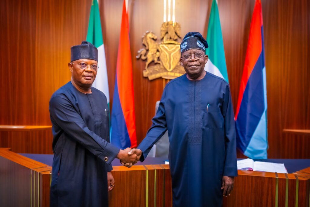 President Bola Tinubu and Vice Admiral Ibok-Ete Ekwe Ibas (rtd), the sole administrator of Rivers State, during a short swearing ceremony at State House, Abuja
