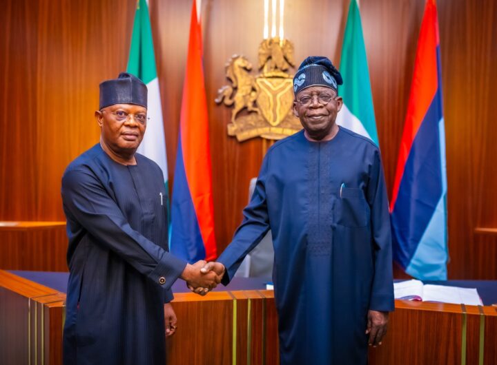 President Bola Tinubu and Vice Admiral Ibok-Ete Ekwe Ibas (rtd), the sole administrator of Rivers State, during a short swearing ceremony at State House, Abuja