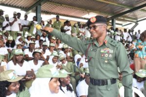 Director-General of the National Youth Service Corps (NYSC), Brig.-Gen. Olakunle Nafiu, addressing corps member in camp