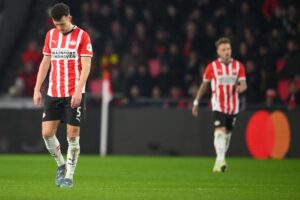 PSV Eindhoven’s Dutch midfielder #22 Jerdy Schouten (C) reacts at the end of the UEFA Champions eague round of 16 first leg football match between PSV Eindhoven (NED) and Arsenal FC (ENG) at the the PSV Stadion, in Eindhoven, on March 4, 2025. (Photo by JOHN THYS / AFP)