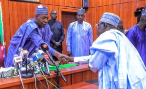 Borno State Governor, Babagana Umara Zulum (right) welcomes Dr. Mohammed Aminu Ghuluze, the newly appointed Head of the State's Civil Service (left), during the swearing-in ceremony in Maiduguri.
