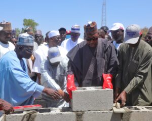 Governor Zulum laying the foundation stone for the construction of the school building