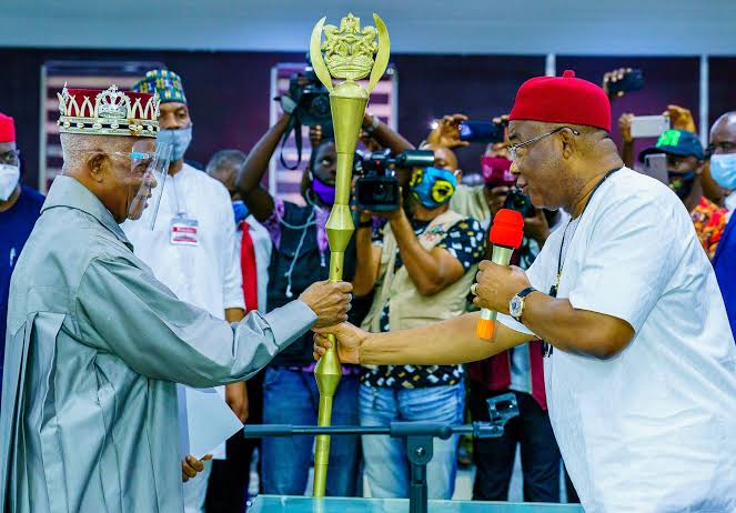 Governor Hope Uzodinma presenting a staff of office to one of the traditional rulers in Imo State