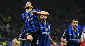 Inter Milan’s Turkish midfielder #20 Hakan Calhanoglu celebrates after scoring a penalty kick for his team’s second goal during the UEFA Champions League round of 16 second-leg football match between Inter Milan and Feyenoord Rotterdam at the San Siro Stadium in Milan, on March 11, 2025. (Photo by Isabella BONOTTO / AFP)