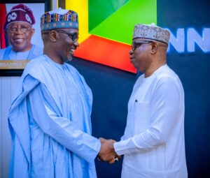 L-R: Former Group CEO NNPC Ltd, Mr. Mele Kyari in a warm handshake with the new GCEO, Mr. Bayo Ojulari shortly after a brief handover ceremony held at the NNPC Towers, Abuja on Friday.