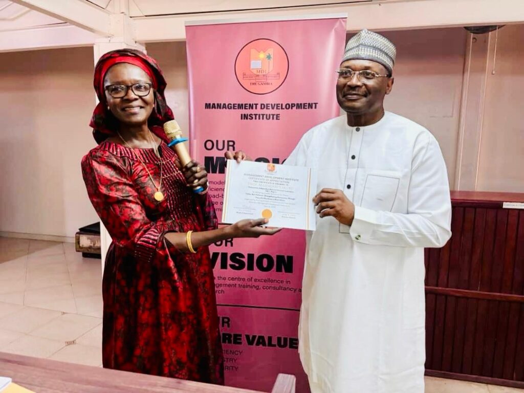 Professor Yakubu being honoured by the Civil Service University in Banjul, The Gambia, after delivering the lecture.