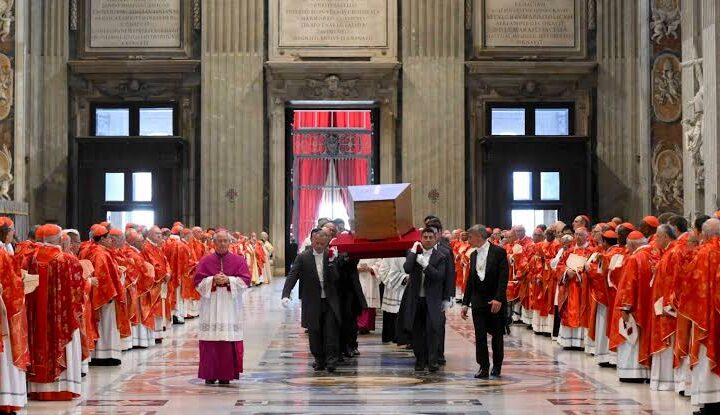 The coffin of late Pope Francis is carried by pallbearers into Santa Maria Maggiore Basilica, in Rome on April 26, 2025. (Photo by Stefano Costantino / AFP)