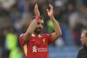 Liverpool’s Egyptian striker #11 Mohamed Salah applauds on the pitch after the English Premier League football match between Leicester City and Liverpool at King Power Stadium in Leicester, central England on April 20, 2025. (Photo by Darren Staples / AFP)