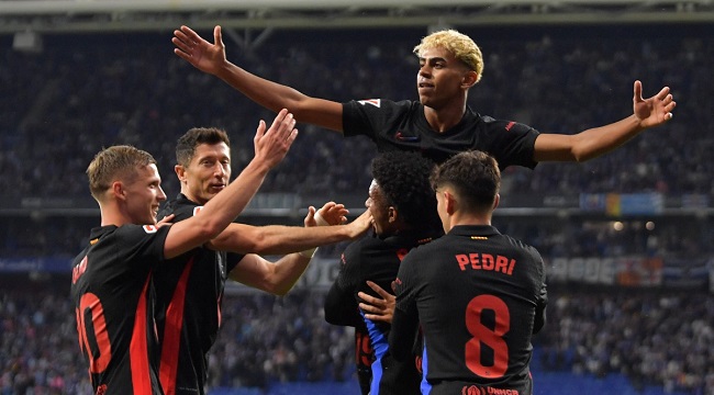 Barcelona’s Spanish forward #19 Lamine Yamal (C) celebrates scoring his team’s first goal during the Spanish league football match between RCD Espanyol and FC Barcelona at the RCDE Stadium in Cornella de Llobregat, on May 15, 2025. (Photo by MANAURE QUINTERO / AFP)