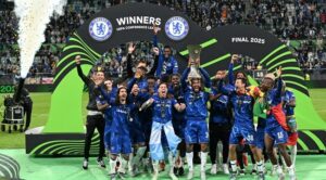 Chelsea’s players celebrate with the trophy during the awarding ceremony after winning the UEFA Conference League final football match between Real Betis and Chelsea FC in Wroclaw on May 28, 2025. (Photo by Sergei GAPON / AFP)