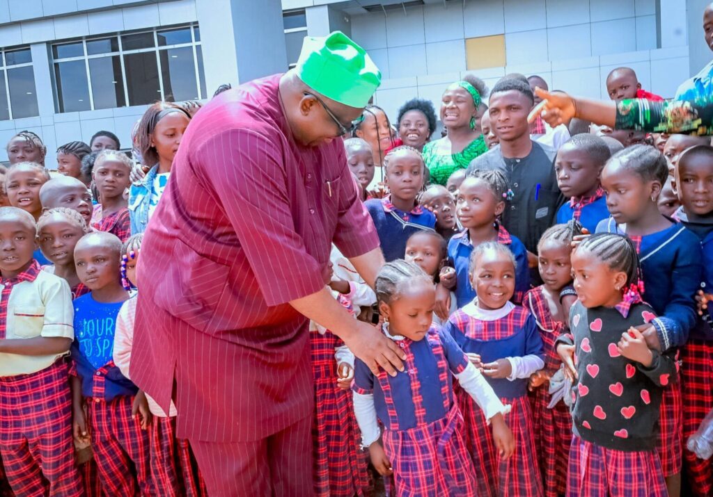 Plateau State Governor, Caleb Mutfwang in the midst of school children