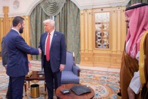 In this photo released by the Saudi Royal Palace, Syria’s interim President Ahmad al-Sharaa, left, shakes hands with President Donald Trump, centre, in Riyadh, Saudi Arabia, Wednesday, May 14, 2025. At right is Saudi Crown Prince Mohammed bin Salman.(Bandar Aljaloud/Saudi Royal Palace via AP)