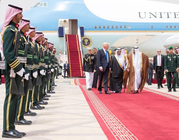 Saudi Arabia's King Salman bin Abdulaziz Al Saud and U.S. President Donald Trump walk during a reception ceremony in Riyadh, Saudi Arabia.