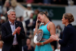Belarus’ Aryna Sabalenka 1 Belarus’ Aryna Sabalenka (C) flanked by French Tennis Federation’s President Gilles Moretton (L) and Former Belgian tennis player Justine Henin, holds her second-placed trophy after losing her women’s singles final match against US Coco Gauff on day 14 of The French Open tennis tournament on Court Philippe-Chatrier at the Roland-Garros Complex in Paris on June 7, 2025. (Photo by Alain JOCARD / AFP)