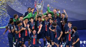 PSG players celebrate with the trophy after the UEFA Champions League final football match Paris Saint-Germain (PSG) and Inter Milan in Munich,