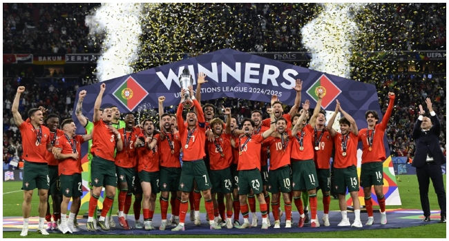 Portugal’s forward #07 Cristiano Ronaldo kisses the trophy after winning the UEFA Nations League final football match between Portugal and Spain in Munich, southern Germany on June 8, 2025. (Photo by Tobias SCHWARZ / AFP)