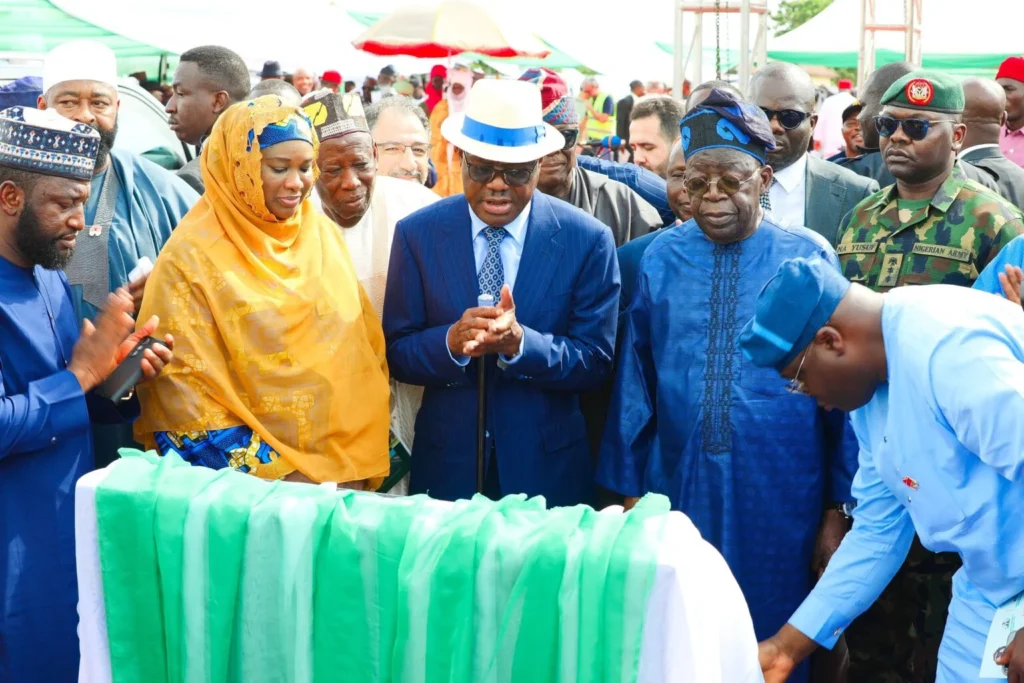 President Bola Tinubu, FCT Minister, Nyesom Wike and FCT Minister of State, Mariya Mahmoud, during the road commissioning ceremony in Kwali Area council of Abuja