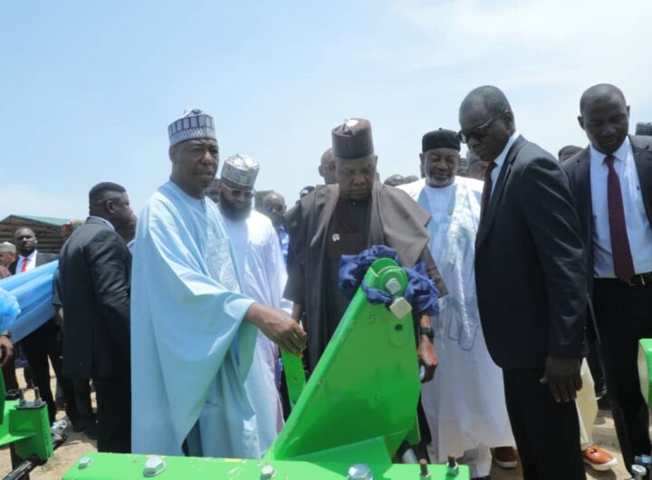 Vice President Kashim Shettima (2nd right) flanked by Governor Babagana Zulum (right) during the commissioning of 375 refurbished tractors by the Borno State Government in Maiduguri."
