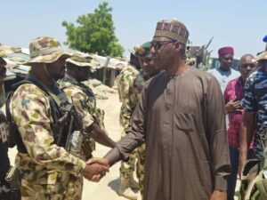 Borno State Governor, Babagana Zulum interfacing with military troops of 68 battalion headquarters in Malam-Fatori