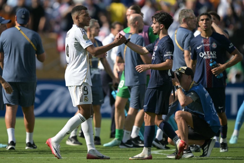 PSG disgrace Real Madrid 4-0 to reach Club World Cup Final 2 Real Madrid’s French forward #09 Kylian Mbappe shakes hands with Paris Saint-Germain’s Portuguese midfielder #17 Vitinha after the FIFA Club World Cup 2025 semifinal football match between France’s Paris Saint-Germain and Spain’s Real Madrid at the MetLife stadium in East Rutherford, New Jersey on July 9, 2025. (Photo by JUAN MABROMATA / AFP)