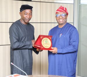 Managing Director of NSITF, Barrister Oluwaseun Faleye, and the NDPC National Commissioner, Dr Vincent Olatunji, during a courtesy visit in Abuja.