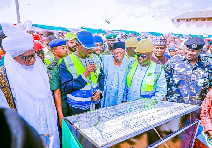 Governor Sule, supported by Senator Abdullahi Adamu and Emir of Keffi, performing the ground breaking flagg of the construction of Keffi fly over.