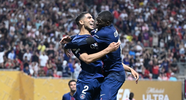 Paris Saint-Germain’s French forward #10 Ousmane Dembele (R) celebrates scoring his team’s second goal with Moroccan defender #02 Achraf Hakimi during the FIFA Club World Cup 2025 quarterfinal football match between France’s Paris Saint-Germain and Germany’s Bayern Munich at the Mercedes-Benz Stadium in Atlanta on July 5, 2025. (Photo by PATRICIA DE MELO MOREIRA / AFP)