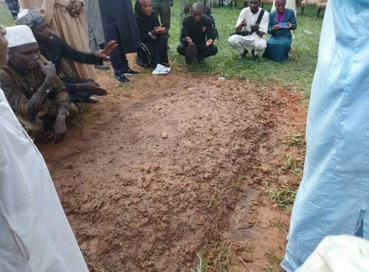 Mourners at the grave site of late President Muhammadu Buhari
