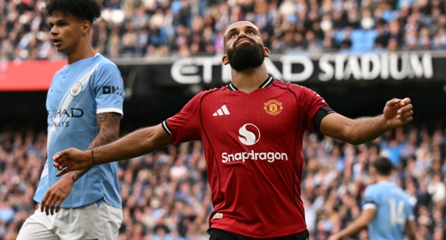 Manchester United’s Cameroonian midfielder #19 Bryan Mbeumo reacts during the English Premier League football match between Manchester City and Manchester United at the Etihad Stadium in Manchester, north west England, on September 14, 2025. (Photo by Oli SCARFF / AFP)