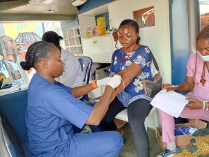 A nurse attending to a patient during the free medical outreach