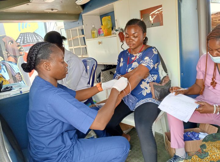 A nurse attending to a patient during the free medical outreach