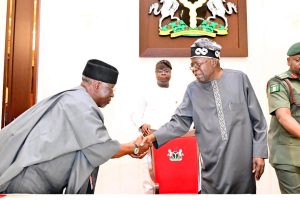 President Bola Tinubu in a handshake with the former Governor of Nasarawa State, Umaru Tanko Al-Makura.