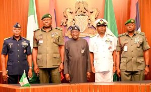 President Bola Tinubu in a group photograph with the new service chiefs