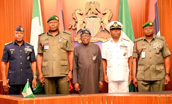 President Bola Tinubu in a group photograph with the new service chiefs