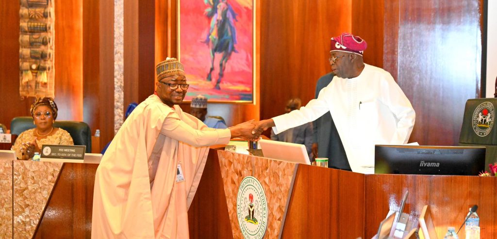 President Bola Tinubu in a handshake with the Minister of Humanitarian Affairs, Bernard Doro, shortly after the swearing in ceremony. Photo credit: State House
