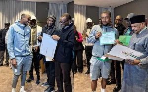 AFCON boost: Tinubu hands Super Eagles national honours, house titles and land documents
