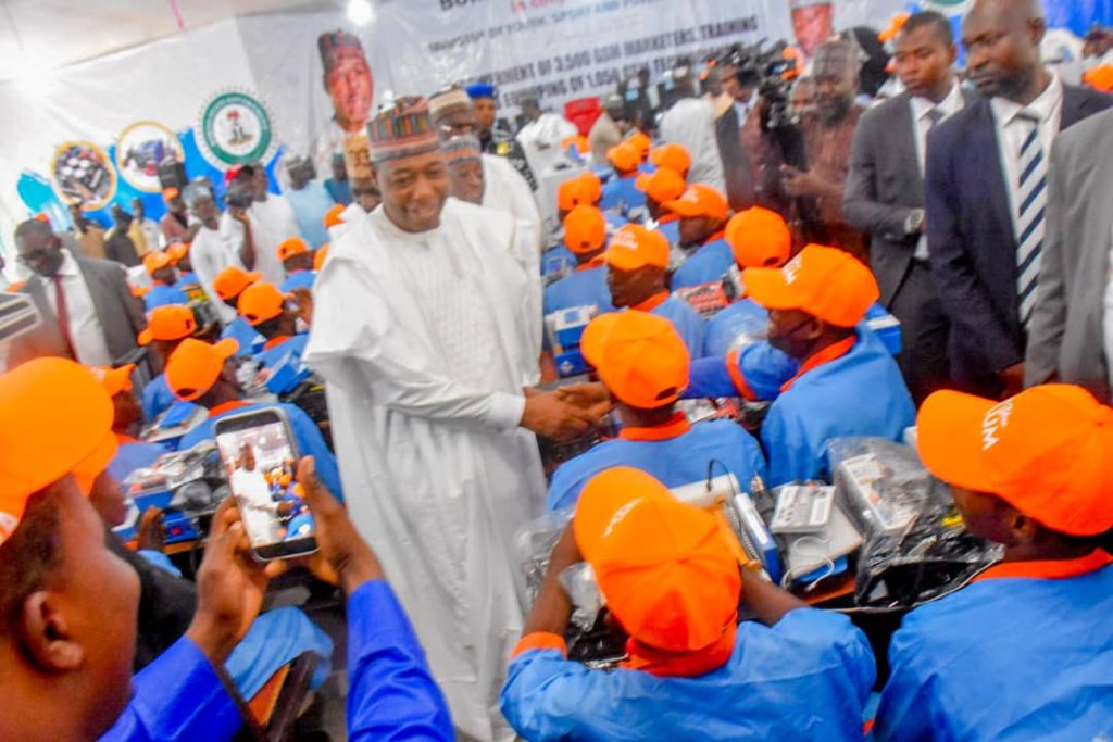 Borno State Governor, Babagana Zulum interacting with the beneficiaries of the youth empowerment scheme