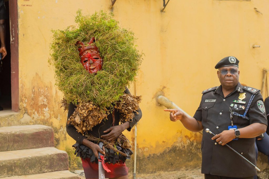 Akwa Ibom State Commissioner of Police CP Baba Azare with suspected masquerade arrested in Uyo