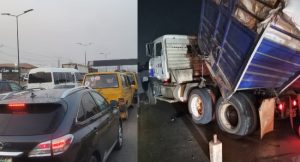 Motorists stranded as fully-loaded truck overturns on Otedola Bridge