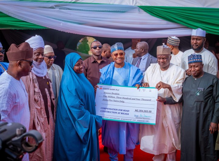 Kaduna State Governor, Uba Sani presenting cheque (compensation) to one of the households affected by the ongoing Rigasa township road projects