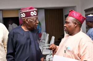 President Bola Tinubu and Aminu Masari