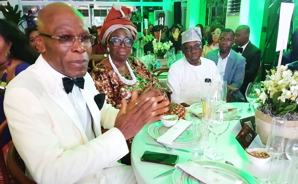 R L President Olusegun Obasanjo his wife Chief Mrs Bola Obasanjo and Mr. Leo Stan Ekeh at the event