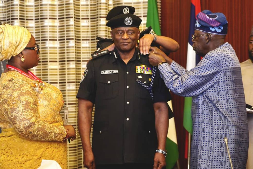 You have my full support, restore peace and security – Tinubu tasks acting IGP Disu 2 President Bola Tinubu decorating the new acting IGP Olatunji Disu. Photo credit: State House Abuja