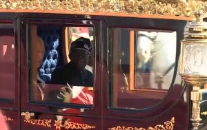 Nigeria's President Bola Tinubu and Britain's King Charles III (obscured) travel in the Australian State Coach to Windsor Castle in Windsor on March 18, 2026, on the first day of a two-day state visit to the United Kingdom by Nigeria's president....